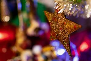 Gold star on christmas tree, decoration and ornament, celebration spirit photo
