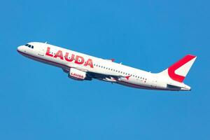 Vienna, Austria, 2023 - Lauda Airbus A320 passenger plane at airport. Aviation and aircraft. Air transport and travel. Transportation. Fly and flying. photo