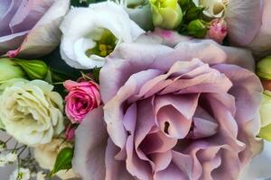 Bouquet of flowers with roses and eustoma photo