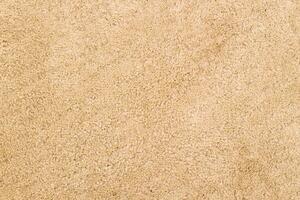 The texture of the beige textile carpet. photo