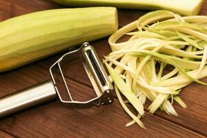 Chopped zucchini into strips, with a light green peeler. photo