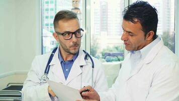 Two experienced doctors read the patients medical certificate video