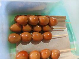 Quail egg satay at a food stall. quail eggs. photo