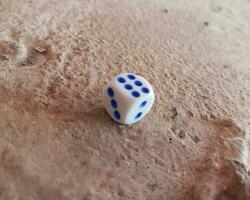 Dice placed on concrete floor surface, selective focus. photo