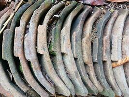 Old asian house roof tile texture, Close up view of old weathered roof photo