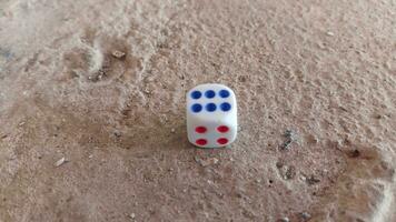 Dice placed on concrete floor surface, selective focus. photo