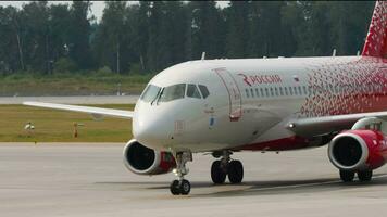 MOSCOW, RUSSIAN FEDERATION JULY 29, 2021 Commercial plane Sukhoi Superjet 100, RA 89060 of Rossiya taxiing at Sheremetyevo airport. Aircraft of Russian Airlines on the airfield video