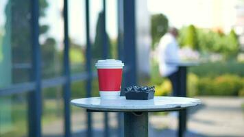 Blank take away kraft coffee cup on table , video