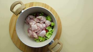 top view of raw chicken breast on dish for cooking . video