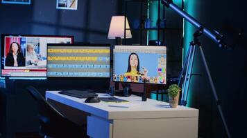 Photo processing software interface on computer screens in creative agency studio, panning shot. Image editing program UI displayed on multi monitors PC setup in photographer workspace video