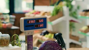 Modern grocery store scale in empty shop used in small business organic farming, freshly harvested produce. Sustainable zero waste supermarket with natural organic fruits and vegetables. Close up. photo