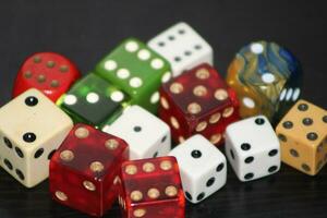 Pile Of Different Colored and Shaped  Dice photo