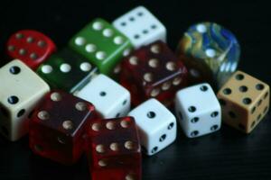 Pile Of Different Colored and Shaped  Dice photo