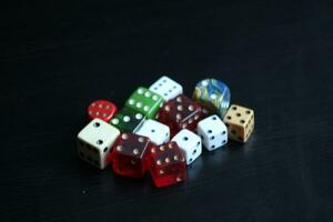 Pile Of Different Colored and Shaped  Dice photo