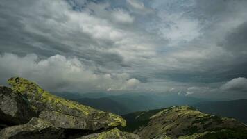 Time lapse of beautiful clouds move over the mountains video