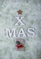 Wooden letter XMAS, Christmas festive card photo