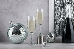 Glass of champagne with disco ball. photo