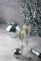 Glass of champagne with disco ball. photo