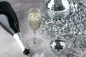 Glass of champagne with disco ball. photo