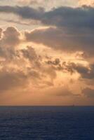 Clouds and Sunrise over the northern sea photo