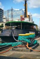 Boat is tied to the Jetty in Hamburg, Germany photo