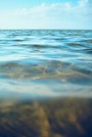 blue sky reflecting in water surface photo