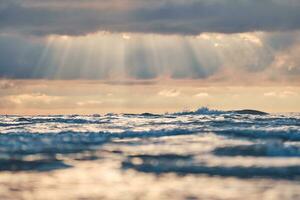 Sunbeams over the wild northern sea photo