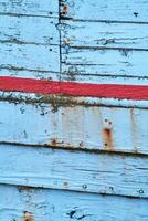 weathered paint on wodden shipping boat photo