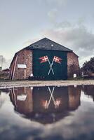 Iconic old boat hut at danish coast photo