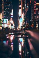Blurred lights of the TImes Square in New York City at night photo