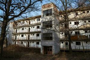 Tab, Hungary, 2021 - Hungarian aged lost place in the forest. Ex soviet, abandoned army base barracks and associated buildings. photo