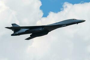 Strategic bomber plane at air base. Air force and army. Airport and airfield. Military aircraft. Aviation industry. photo