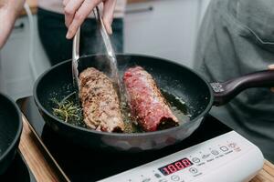 Cooking meat rolls in a frying pan in the cooking class. Beef roll with spices. Cooking process, close-up. photo