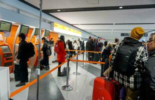 Sapporo City, Japan, 2018 - Image of many tourists waiting for check in front of Jetstar airline counter in New Chitose airport. Jetstar is a low-fare Japanese airline serves 14 destinations photo