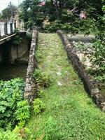 surface of ancient arch bridge on river Makho photo