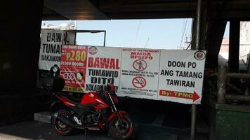 Manila, Philippines on April 8, 2019. Banner or public service banner on the side of the road in Manila, photo