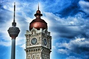 Kuala Lumpur, Malaysia on May 22, 2023. Close up of the clock tower, Big Ben Malaysia. Seen the Kuala Lumpur Tower. Near Masjid Jamek station. photo