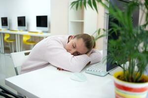 young woman is sad at the workplace. office work concep photo