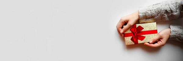 hands hold a gift on a white background photo