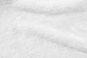 White clean wool texture background. light natural sheep wool. white seamless cotton. texture of fluffy fur for designers. close-up fragment white wool carpet. photo