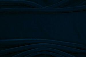 Gradient Dark blue velvet fabric texture used as background. navy color fabric background of soft and smooth textile material. crushed velvet .luxury blue tone for silk. photo