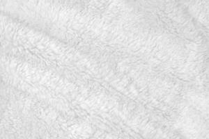 White clean wool texture background. light natural sheep wool. white seamless cotton. texture of fluffy fur for designers. close-up fragment white wool carpet. photo