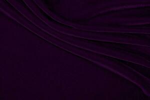textura de tela de terciopelo púrpura utilizada como fondo. fondo de tela púrpura vacío de material textil suave y liso. hay espacio para el texto.. foto