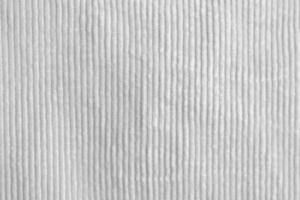 white corduroy fabric texture used as background. clean fabric background of soft and smooth textile material. cloth, velvet, .luxury white tone for silk. photo