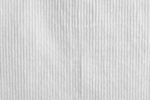 white corduroy fabric texture used as background. clean fabric background of soft and smooth textile material. cloth, velvet, .luxury white tone for silk. photo