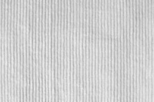 white corduroy fabric texture used as background.  clean fabric background of soft and smooth textile material. cloth, velvet, .luxury white tone for silk. photo