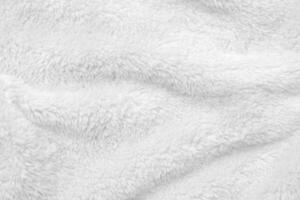 White clean wool texture background. light natural sheep wool. white seamless cotton. texture of fluffy fur for designers. close-up fragment white wool carpet. photo