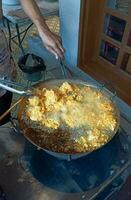 tempe fried in a frying pan ready to eat photo