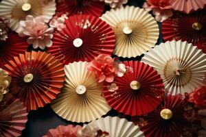 AI generated paper fans with red, ivory and gold patterns photo