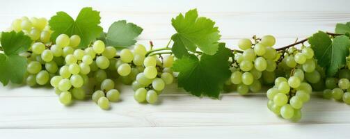 AI generated grapes hanging from a white wooden background with leaves photo